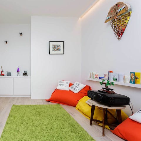 Cosy up in the TV room and project your favourite movies