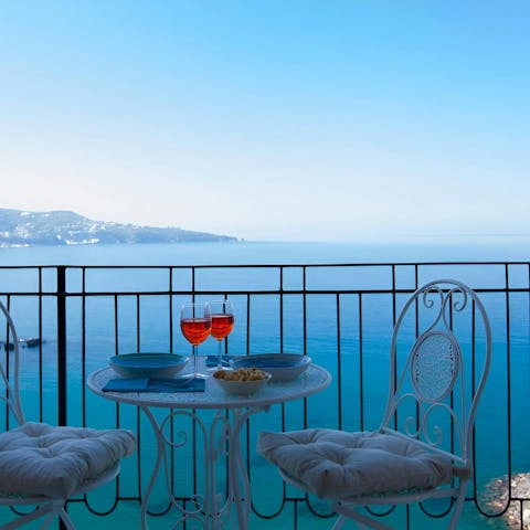 Enjoy after dinner drinks on the balcony as you drink in the sea view