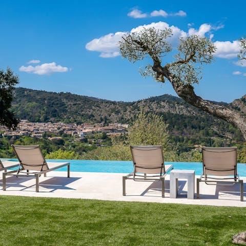 Drink in the stunning views from the heated infinity pool