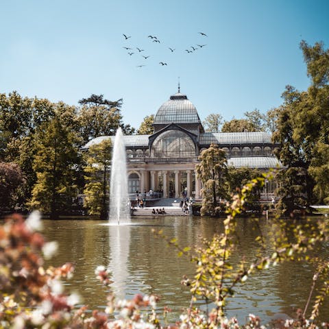 Enjoy sunny afternoon strolls in El Retiro Park, less than a half-hour walk away