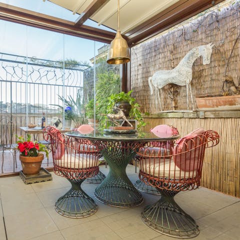 Enjoy views of Janiculum Hill as you dine alfresco