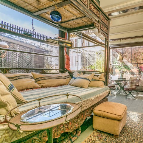 Relax on the day bed in the winter garden