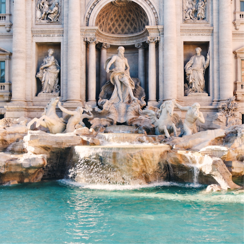 Join in the tradition of throwing a coin into the Trevi Fountain