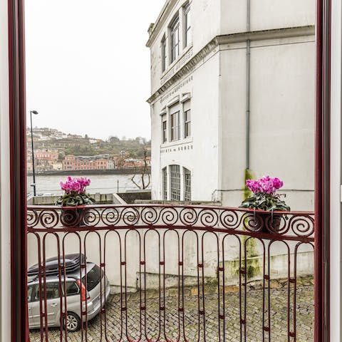 A balcony with a lovely street view