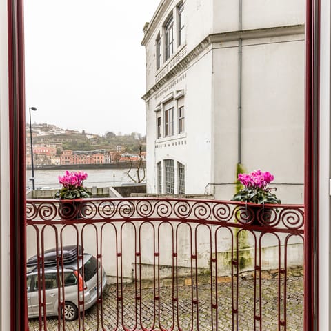 A balcony with a lovely street view