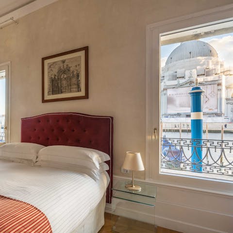 Admire the Basilica della Salute from the main bedroom