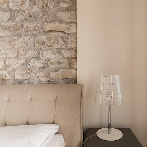 The exposed brickwork in the bedroom