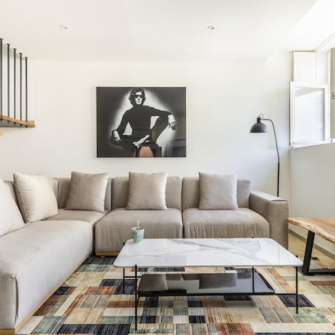 Recline on the huge L-shaped sofa with a glass of Portuguese wine