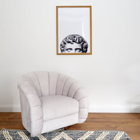 Curl up with a book on the scalloped armchair