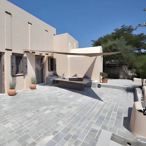 Sit and chat beneath the shade in the courtyard