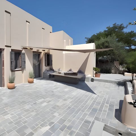 Sit and chat beneath the shade in the courtyard