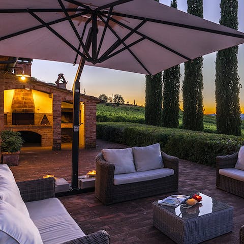 Come together for evening drinks as the setting sun peeks through the cypress trees