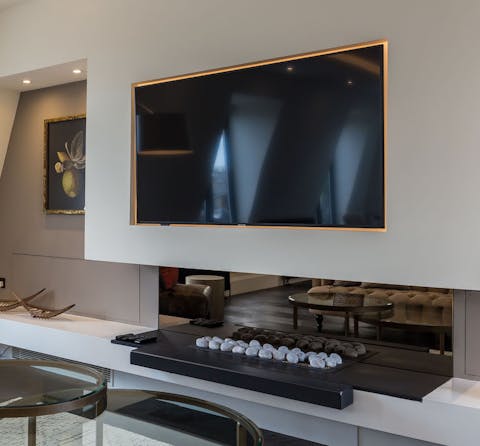 An impressive TV and fireplace
