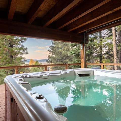 Enjoy the view framed by pines from the hot tub on the deck