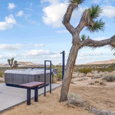 Soak in the outdoor hot tub with a view to rival any other company