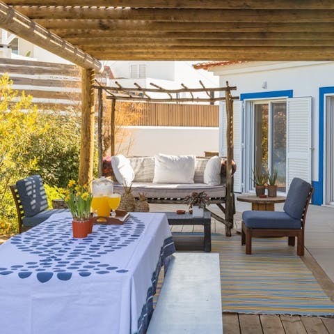 Seek shelter from the midday sun on the covered terrace
