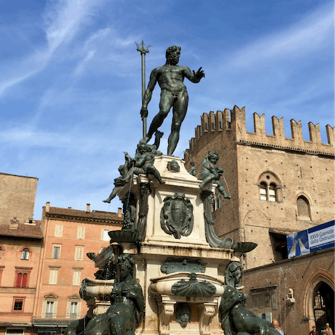 Take a seven-minute stroll to the Piazza Maggiore and Fountain of Neptune