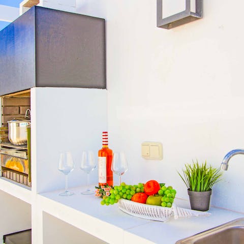 Get cooking in the handy outdoor kitchen and barbecue