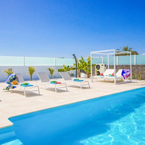 Lie back on the sun loungers after a swim and catch some rays