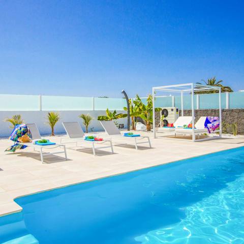 Lie back on the sun loungers after a swim and catch some rays