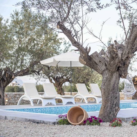 Kick back by the private pool or take a swim in the  crystal waters