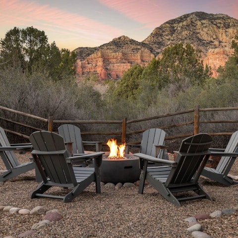 Unwind by the fire pit with a glass of local wine in hand