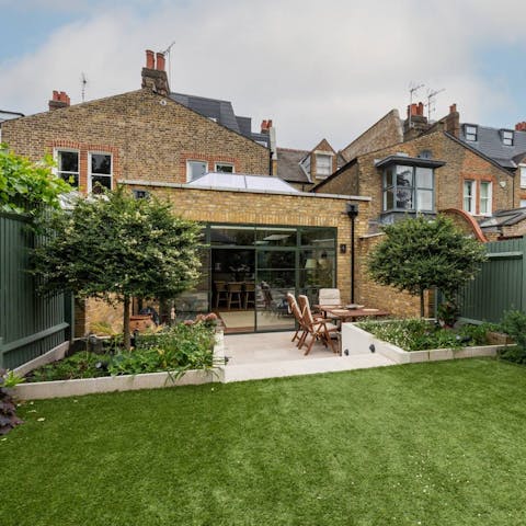 Open the floor-to-ceiling glass doors to the terrace