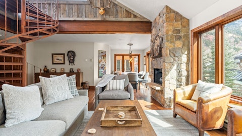 Gather around the cosy stone fireplace after a busy day of hiking