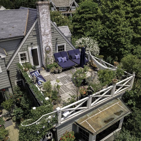 Gather on the roof terrace for drinks in the sunshine