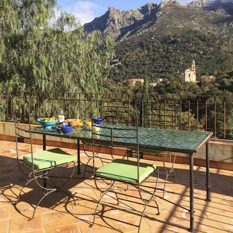 Dine on French delicacies alfresco and admire the spectacular mountain views