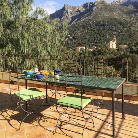 Dine on French delicacies alfresco and admire the spectacular mountain views