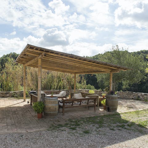 Gather under the pergola for food and drink
