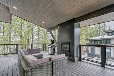 Gather around the crackling outdoor fire as the forest draws near