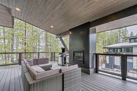 Gather around the crackling outdoor fire as the forest draws near