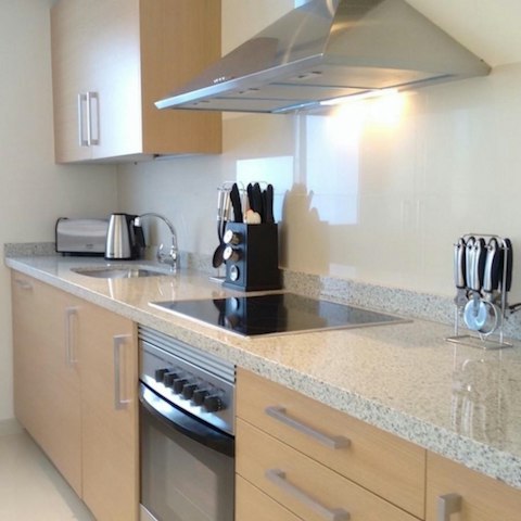 Rustle up a tasty dinner in the sleek, modern kitchen for a quiet evening in