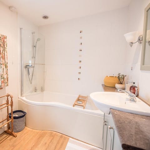 Settle back into the large bathtub and relax