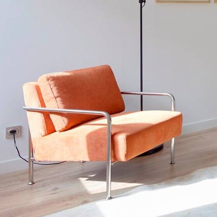 Kick back in this tangerine chair
