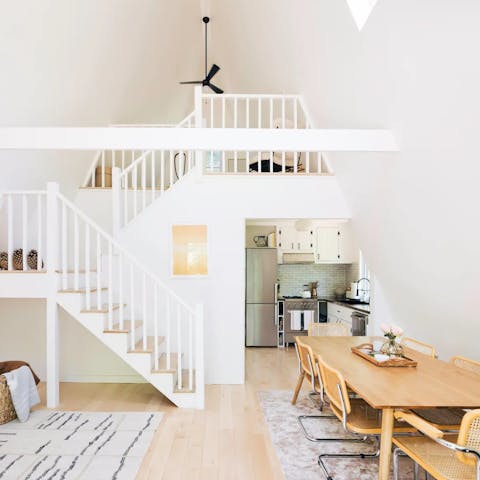 Relax in the calming, all-white interior with its tall ceilings and natural light