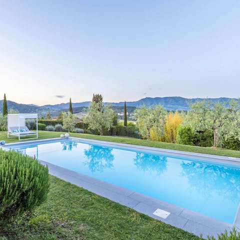 Enjoy beautiful views while relaxing by the pool