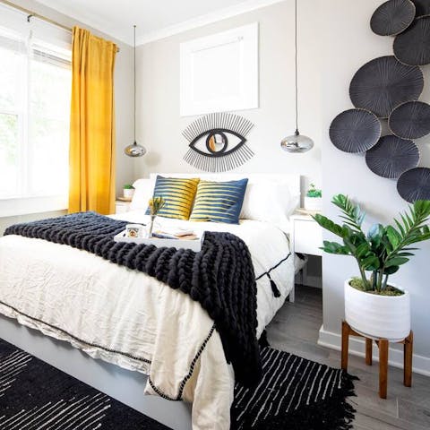 Get some rest in the comfy bedroom after sightseeing in Atlanta