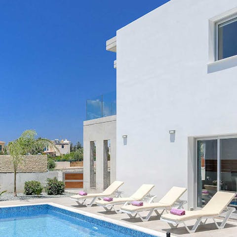 Laze in the sunshine from the poolside loungers
