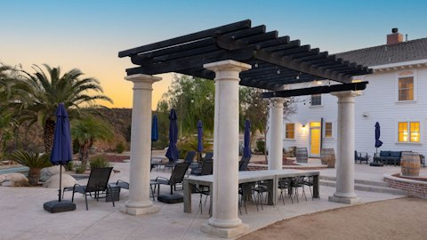 Dine alfresco beneath string lights as the sun goes down