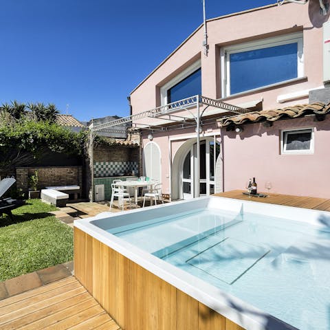 Unwind with a glass of red at the end of the day in the hot tub