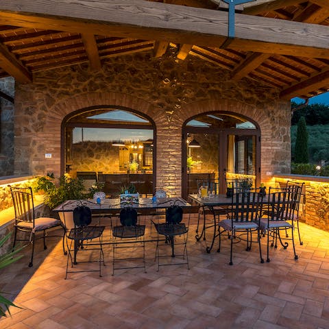 Sip a sundowner before feasting on a sumptuous meal in the beautiful alfresco seating area