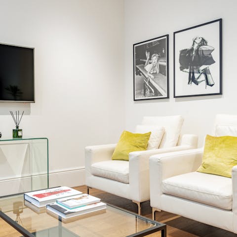 Get comfy in one of the chic armchairs and leaf through a coffee table book