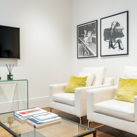 Get comfy in one of the chic armchairs and leaf through a coffee table book