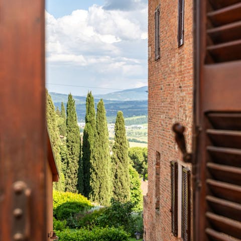 Admire views of the Tuscan countryside as you sip a glass of wine