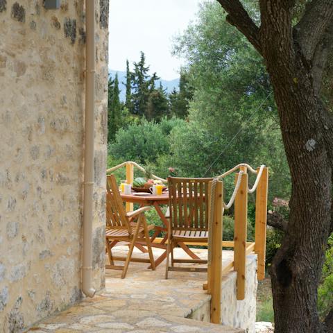 Eat alfresco on your private terrace overlooking the forest