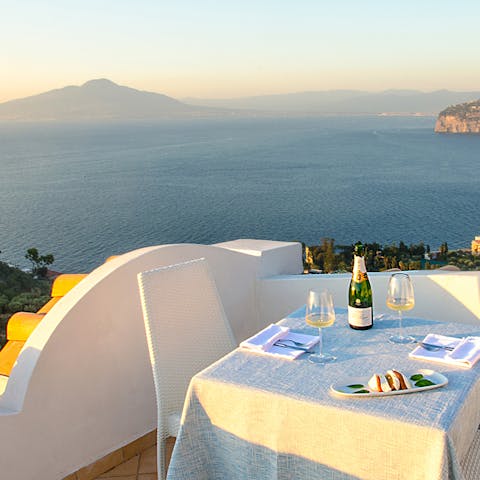 Sip cocktails on the roof terrace while admiring views of Mount Vesuvius