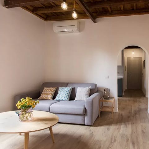 Relax in the living room with a glass of Italian wine
